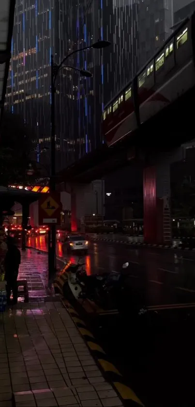 Rain-soaked city street at night with illuminated train and buildings.