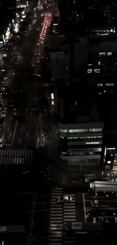 A city's night street view with bustling traffic and illuminated buildings.