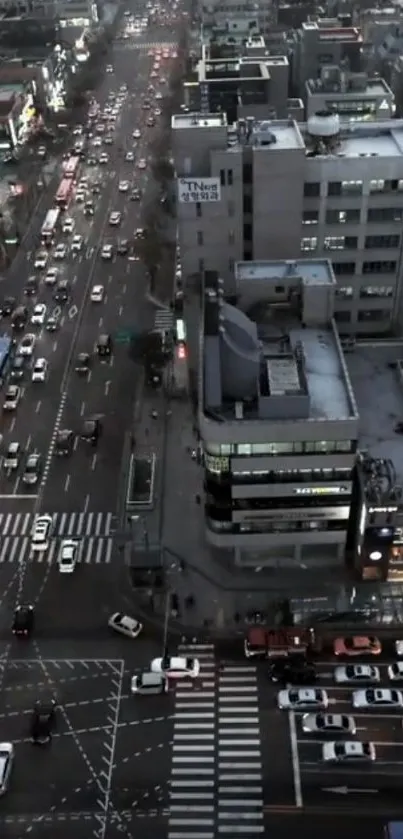 Aerial view of city streets with bustling nighttime traffic.