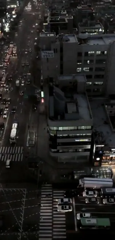 Nighttime cityscape with busy streets and illuminated buildings.