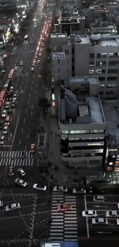 Aerial view of bustling city traffic at night with illuminated streets.