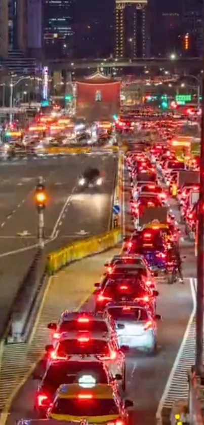 City traffic at night with vibrant red lights.