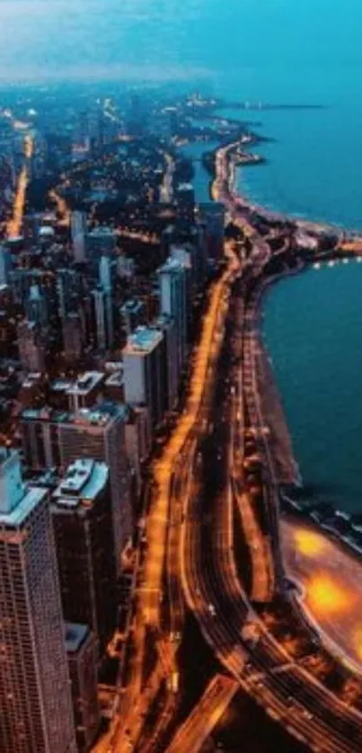 A stunning aerial view of a cityscape at night with glowing streetlights along the coastline.