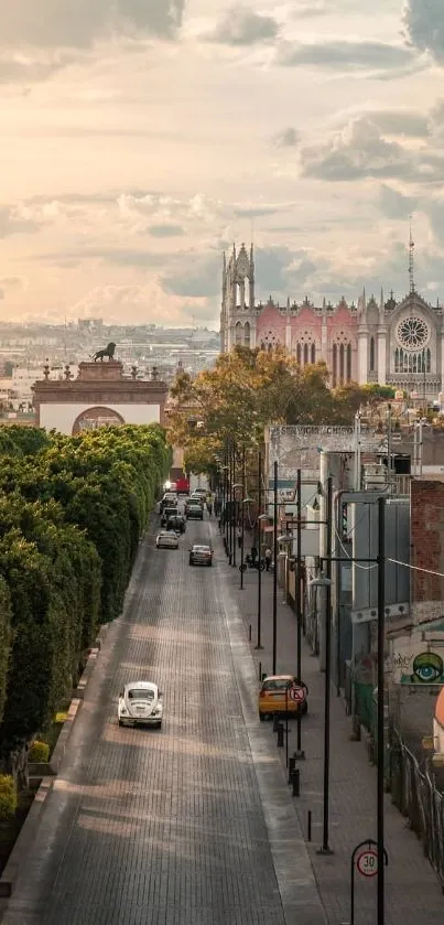 A tranquil city street leading to a Gothic cathedral, with cloudy skies overhead.