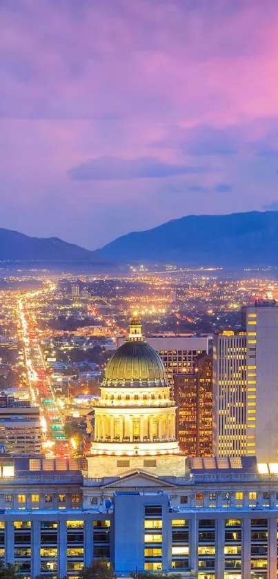 Evening cityscape glowing under a vibrant sunset with illuminated buildings.