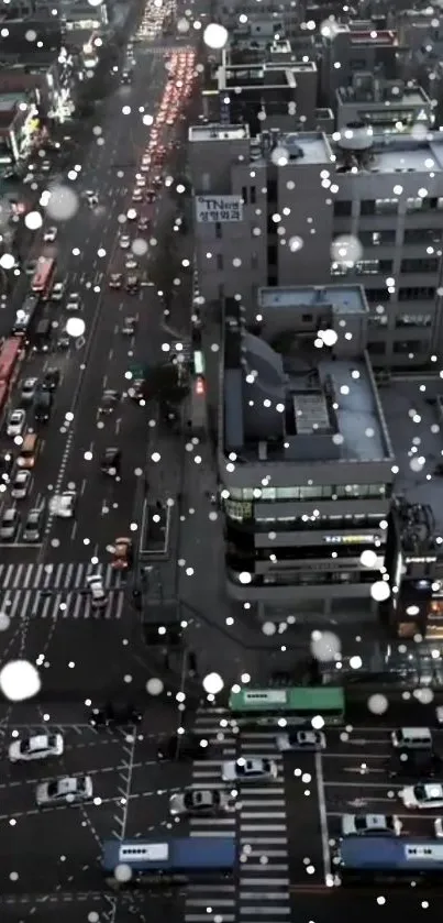 Nighttime cityscape with falling snowflakes.