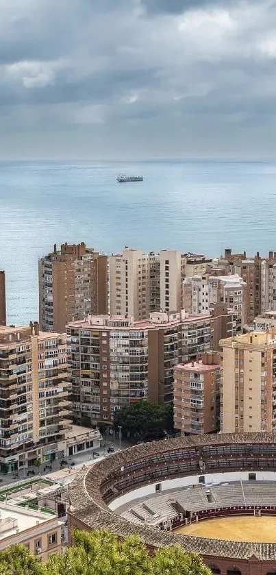 A cityscape with buildings and ocean under a cloudy sky.