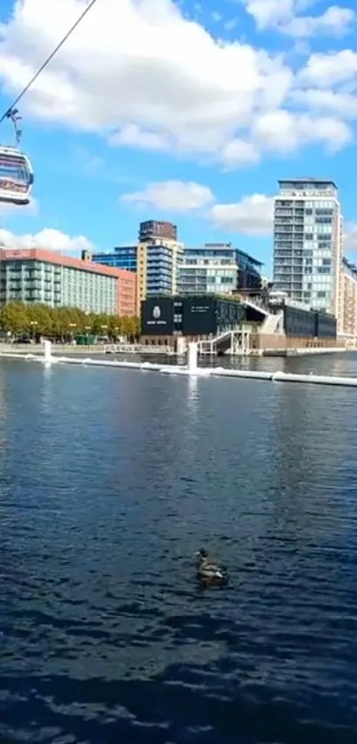 Cityscape with cable car over water, modern buildings visible.