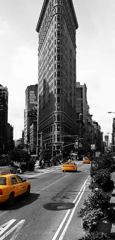 Black and white cityscape with yellow taxis.