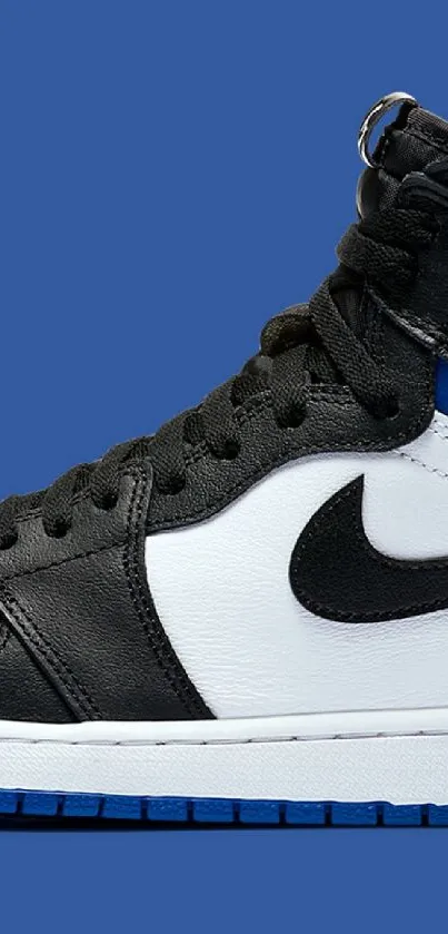 Air Jordan sneaker on bold blue background wallpaper.