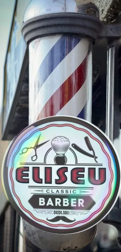 Classic barber shop pole with vintage sign in red, white, and blue colors.