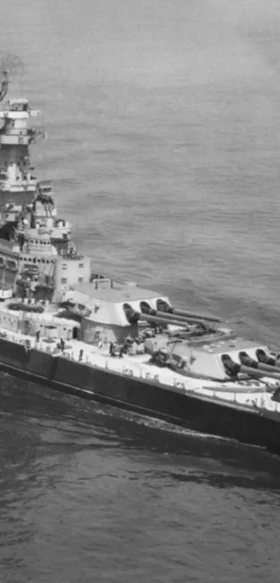 Black and white vintage battleship on the ocean.