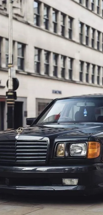 A classic black car parked on an urban street, perfect for enthusiasts.