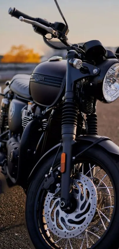 Classic black motorcycle with chrome accents in an urban setting.