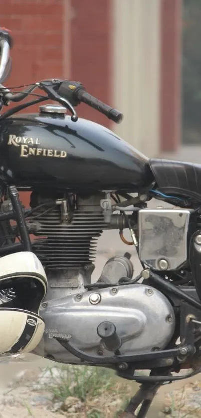 Black Royal Enfield motorcycle with helmet.