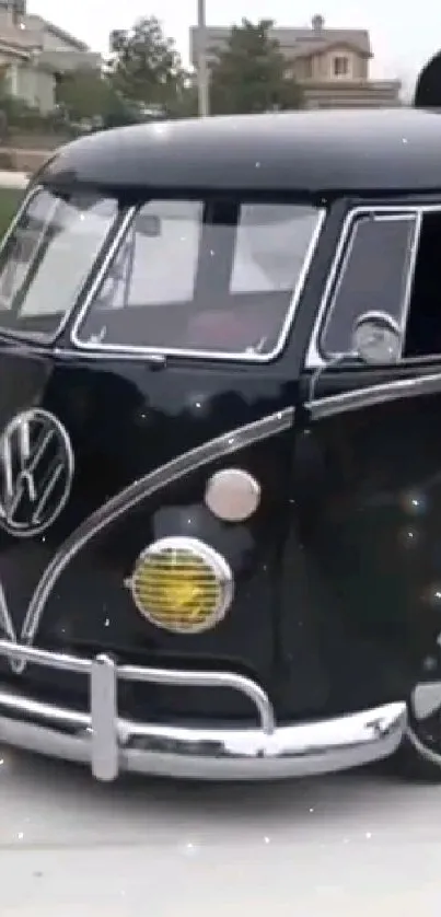 Classic black VW bus parked on a suburban street.