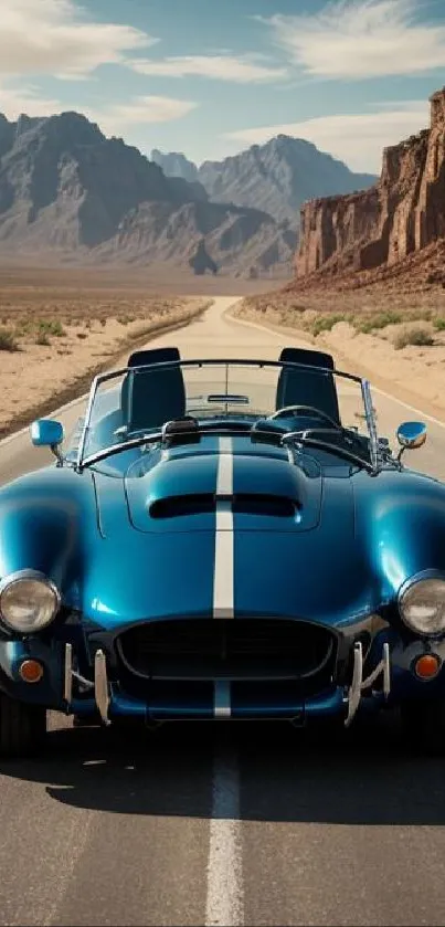 Blue sports car on empty desert road with mountains in background.