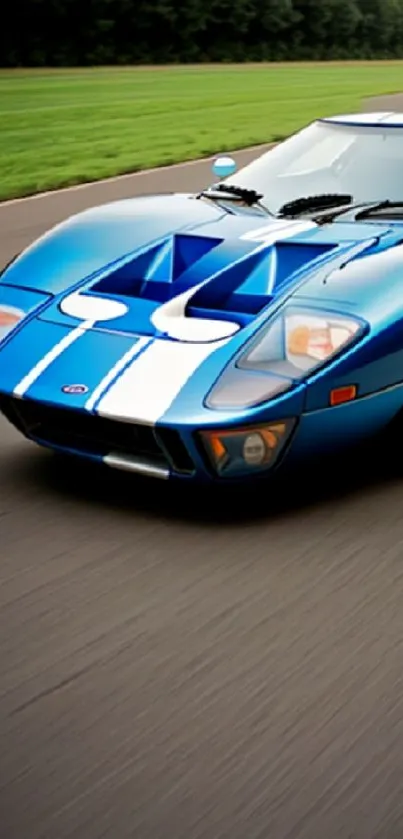 Blue sports car racing on open road wallpaper.