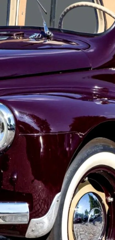 Mobile wallpaper of a classic burgundy car with vintage design and elegance.