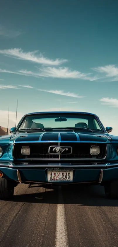 Vintage blue car on desert road under sky.