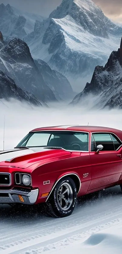 Vintage red car with snowy mountain backdrop.