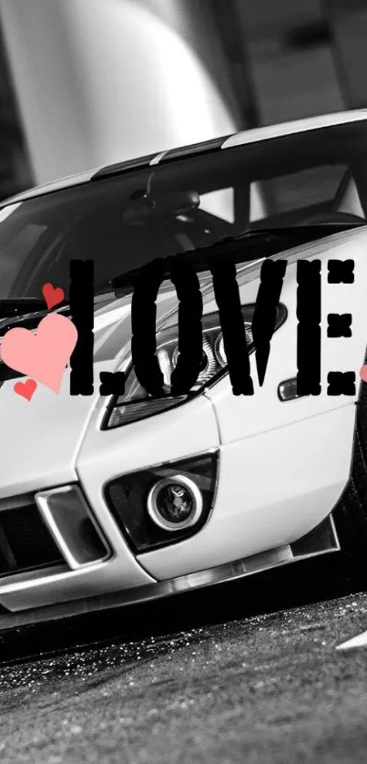 Black and white classic car with 'LOVE' text overlay and hearts.