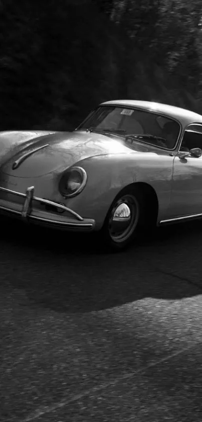 Black and white vintage car wallpaper on road.