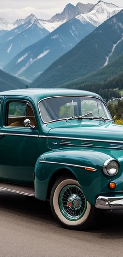 Vintage teal car on mountain road with scenic backdrop.
