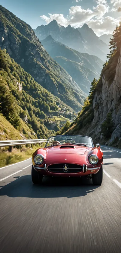 Red convertible drives on mountain road with stunning scenery.