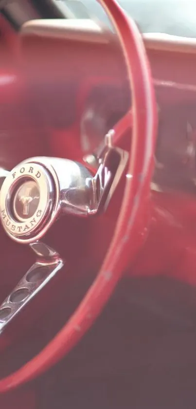 Close-up of a classic red car steering wheel in vintage style.