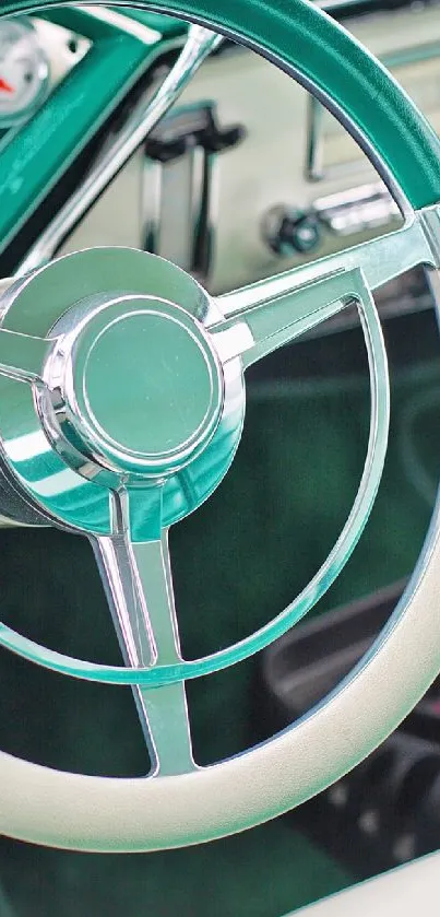 Vintage teal steering wheel in classic car interior.