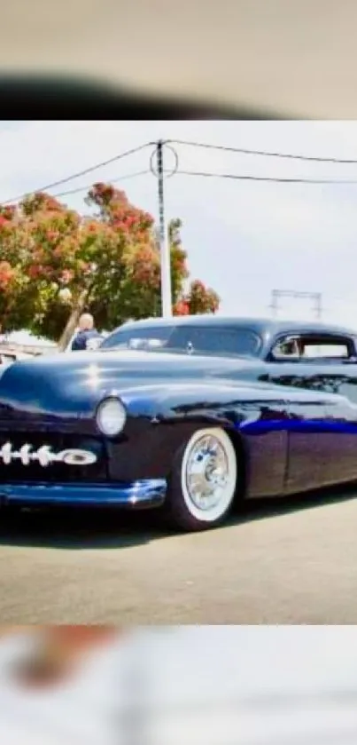 Elegant vintage car in vibrant street view setting.