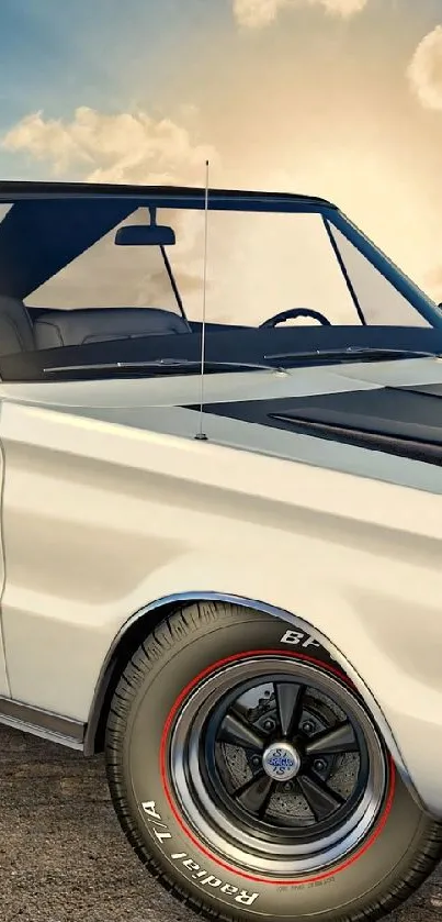 Classic car parked at sunset with scenic sky.