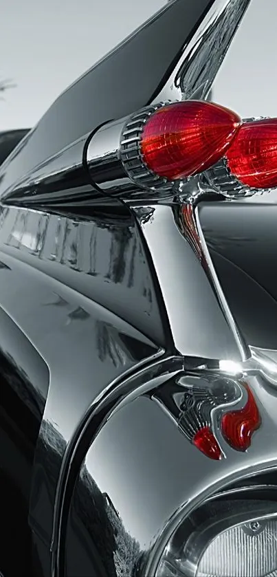 Close-up of a classic car tail fin with chrome details.