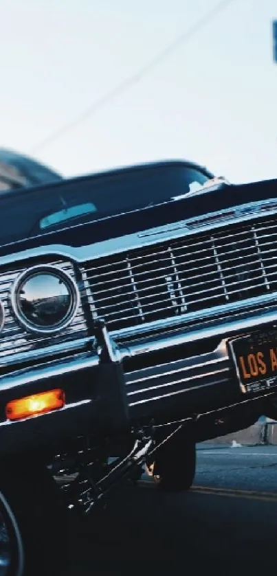 Classic car lifts on Los Angeles street.