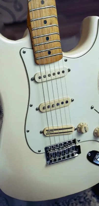 Close-up of a classic cream electric guitar.