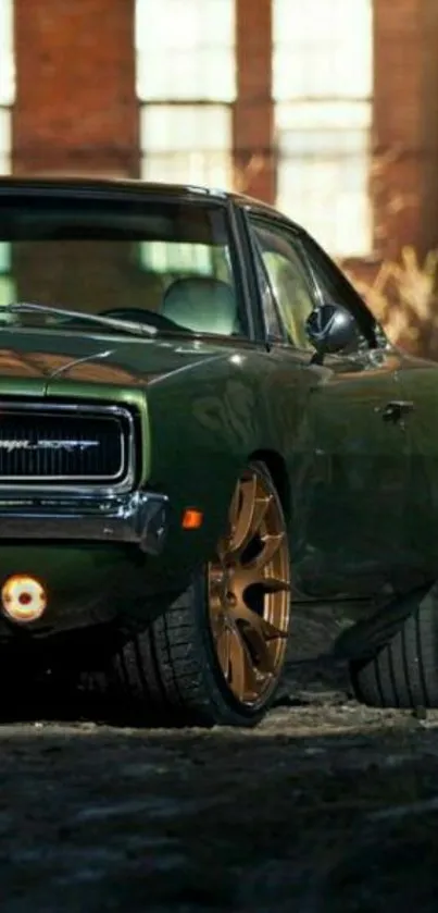 Classic green car with golden wheels in industrial setting.