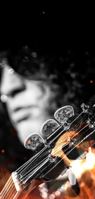 Black and white silhouette of a guitarist and guitar headstock.