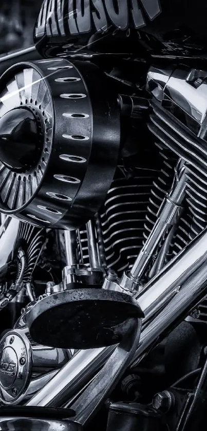 Black and white image of a classic motorcycle engine with chrome details.