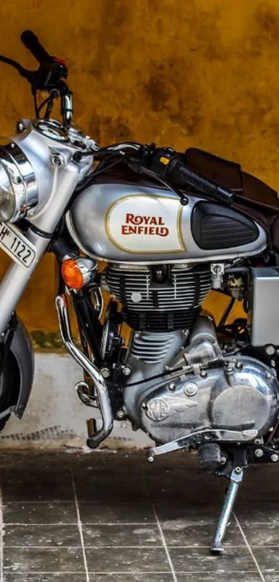 Royal Enfield motorcycle on ochre background.