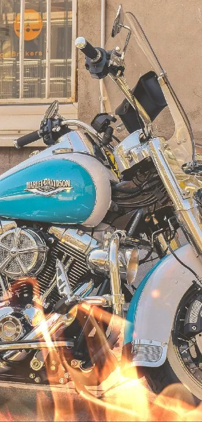 Classic motorcycle parked with turquoise highlights against a rustic wall.