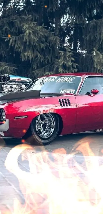 Wallpaper of a classic red muscle car parked on pavement.