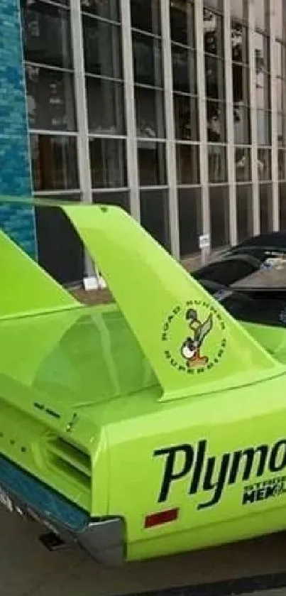 Two lime green classic muscle cars parked in an urban setting.