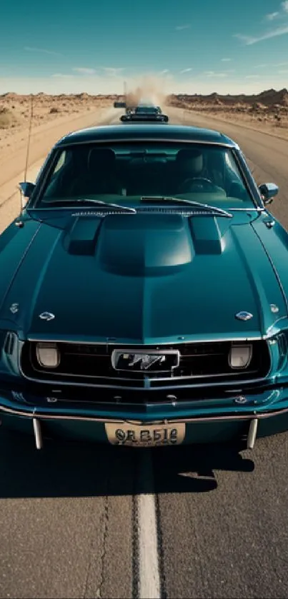 Vintage teal Mustang cruising down a desert highway with mountains in the background.