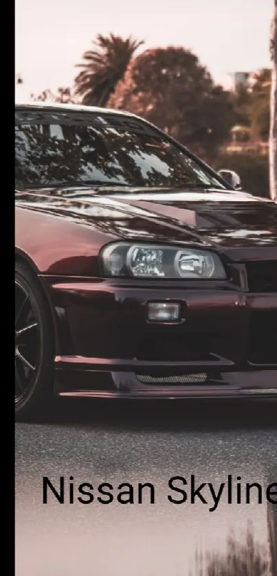 Maroon Nissan Skyline GT-R parked on street.