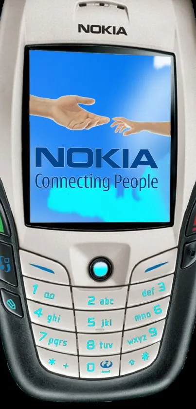 Vintage Nokia phone with 'Connecting People' slogan on screen.