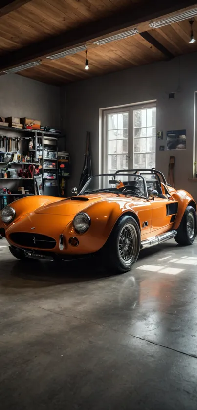 Vintage orange car in a garage workspace.