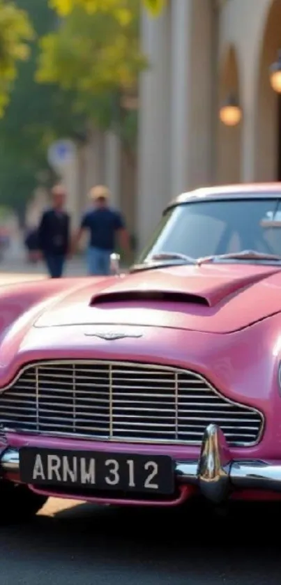 Vintage pink car parked on city street with blurred background.
