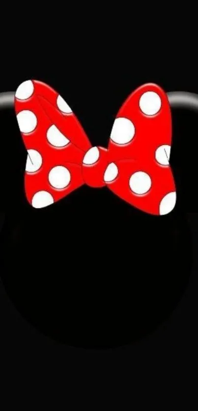 Mobile wallpaper with red polka dot bow on black background.