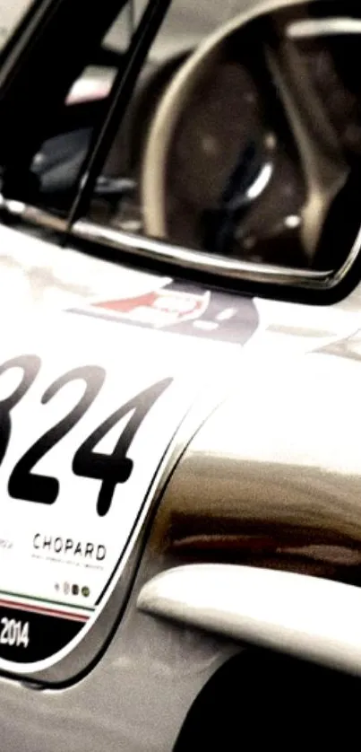 Close-up of a vintage racing car with number 324 on its side.